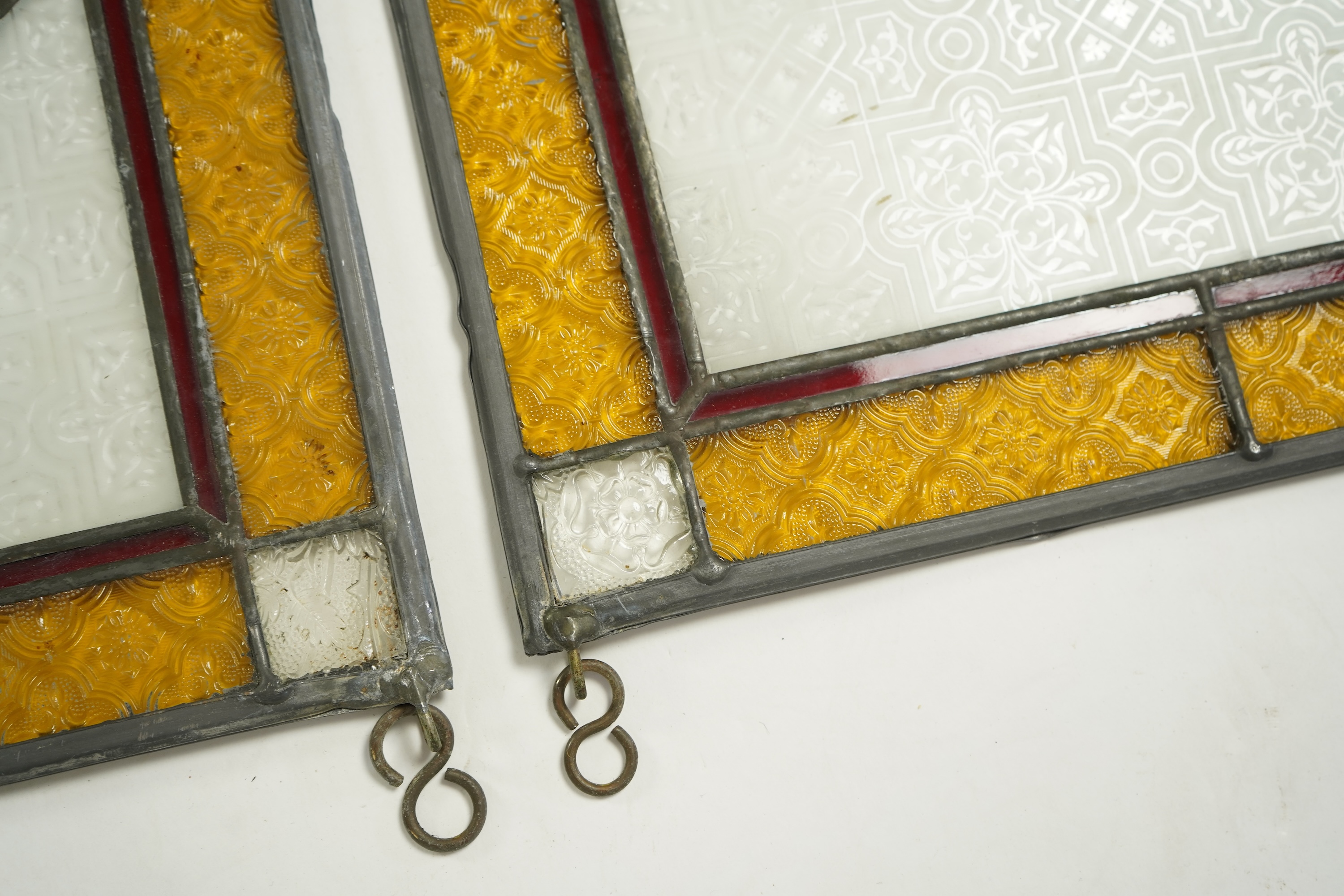 A pair of 20th century stained glass panels